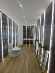 Modern bathroom with unique lighting and wooden flooring