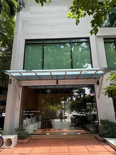 front entrance of a modern building with glass doors and large windows