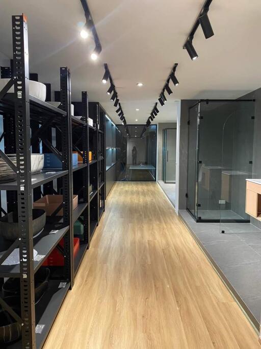 Modern storage room with shelving and wooden floor