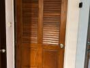 wooden door leading to a toilet