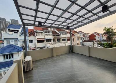 Spacious balcony with a view of nearby houses