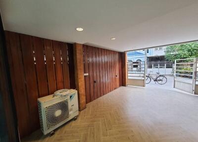 Spacious garage with wooden paneling and natural light