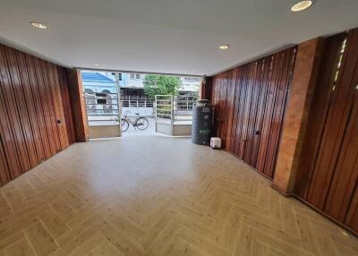 Spacious Room with Wooden Paneling and Outdoor View