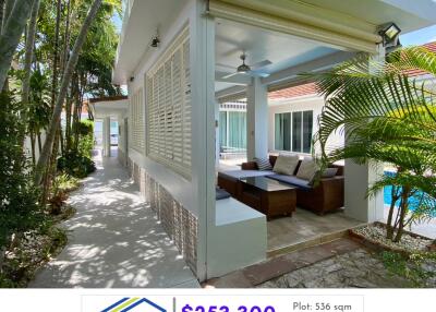 Outdoor seating area with pool view