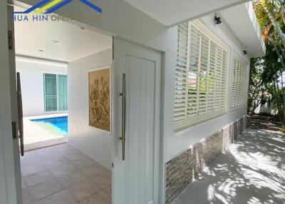 entrance to a house with pool view and patio