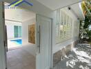 entrance to a house with pool view and patio