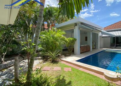 Outdoor area with swimming pool and garden