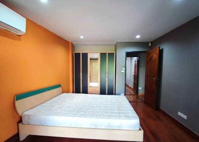 Spacious bedroom with a double bed and large wardrobe