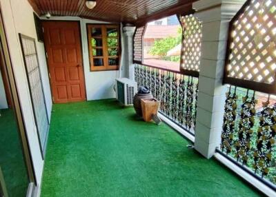 Covered balcony with artificial turf flooring