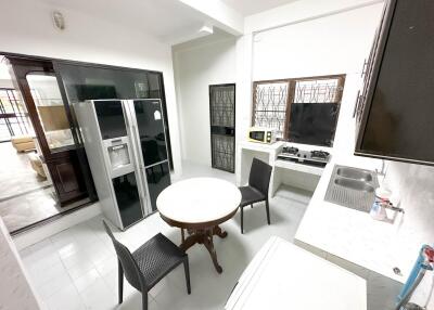 Modern kitchen with dining area and appliances