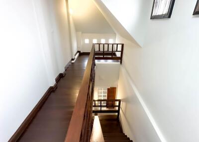 Interior staircase with wooden steps and railing