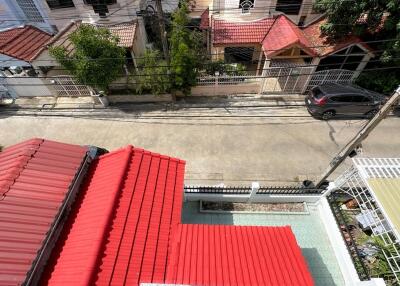 Aerial view of a residential neighborhood with red-roofed houses