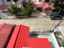 Aerial view of a residential neighborhood with red-roofed houses