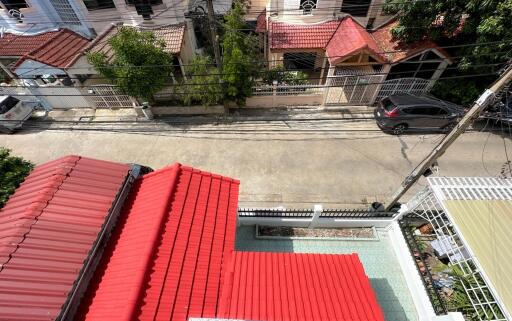 Aerial view of a residential neighborhood with red-roofed houses