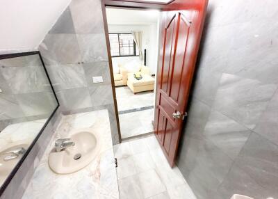 Bathroom with a view into a living room