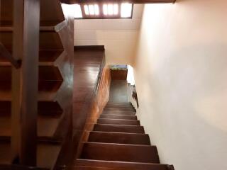 Wooden staircase with natural light