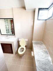 Modern bathroom with sink, toilet, and shower area