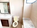 Modern bathroom with sink, toilet, and shower area