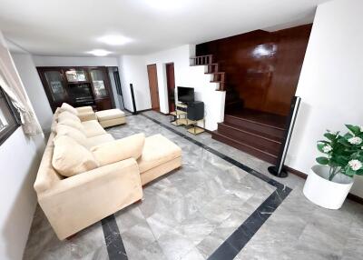 Spacious living room with staircase