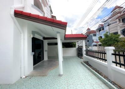 Front porch area of a house with tiled flooring and covered space