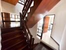 Indoor wooden staircase leading to the upper floor