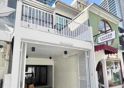 Two-story building with a garage and modern facade