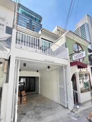 Two-story building with a garage and modern facade