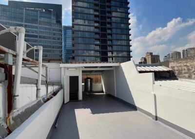 Rooftop with view of nearby high-rise buildings