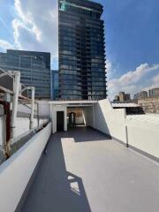 Rooftop with view of nearby high-rise buildings