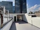 Rooftop with view of nearby high-rise buildings