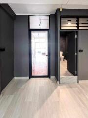 Interior corridor with view into bathroom and main living area