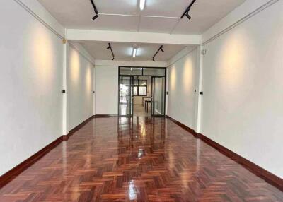 spacious room with wooden parquet flooring