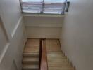 Wooden staircase with natural light