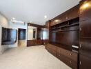 Spacious living room with wooden built-in cabinets