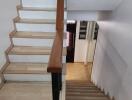 Indoor staircase with wooden steps and handrails