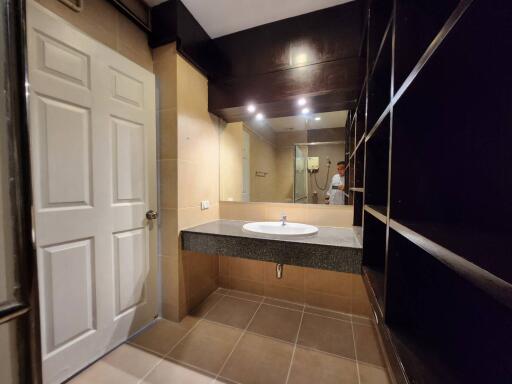 Modern bathroom with sink and shelving