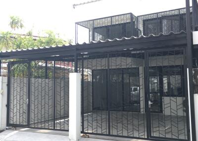 Modern building facade with gated entrance