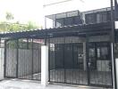 Modern building facade with gated entrance