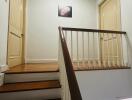 Interior staircase with wooden steps and railing