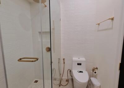 Modern bathroom with glass shower and toilet