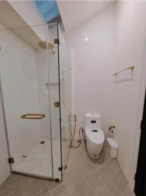 Modern bathroom with glass shower and toilet