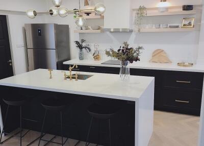 Modern kitchen with island and stainless steel appliances