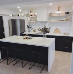 Modern kitchen with island and stainless steel appliances