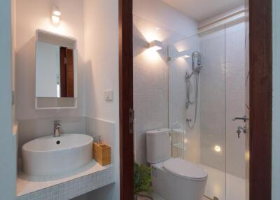 Modern bathroom with shower area and sink