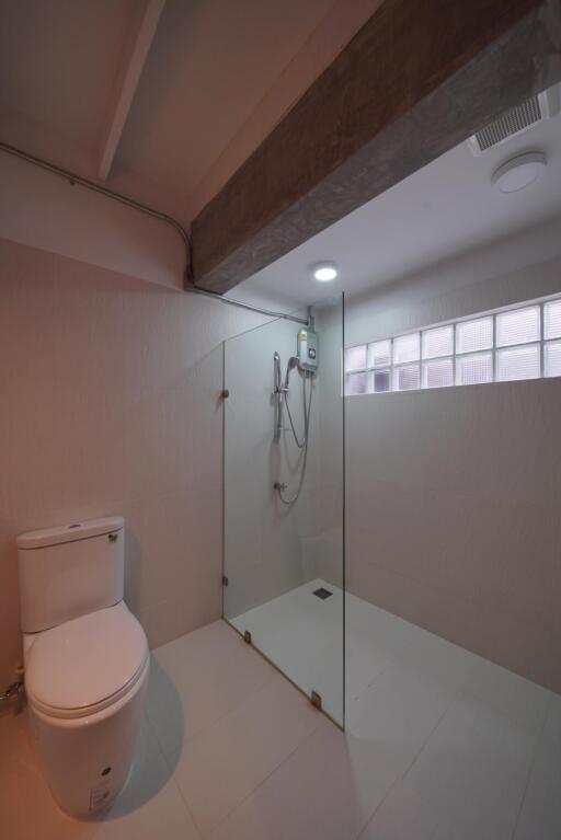 Modern bathroom with glass-enclosed shower