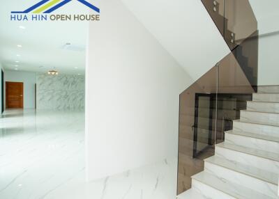 Modern interior of a house with a staircase and hallway