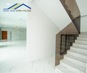 Modern interior of a house with a staircase and hallway