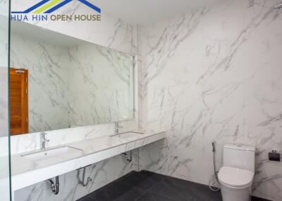 modern bathroom with large mirror and double sinks