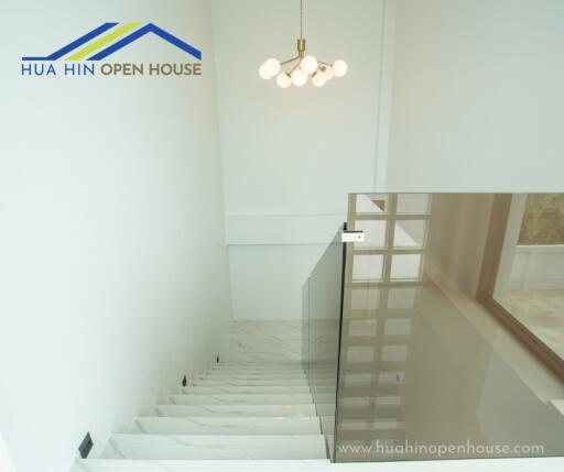 Interior staircase with glass railings