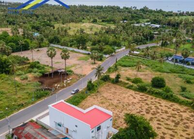 Aerial view of a property with surrounding greenery